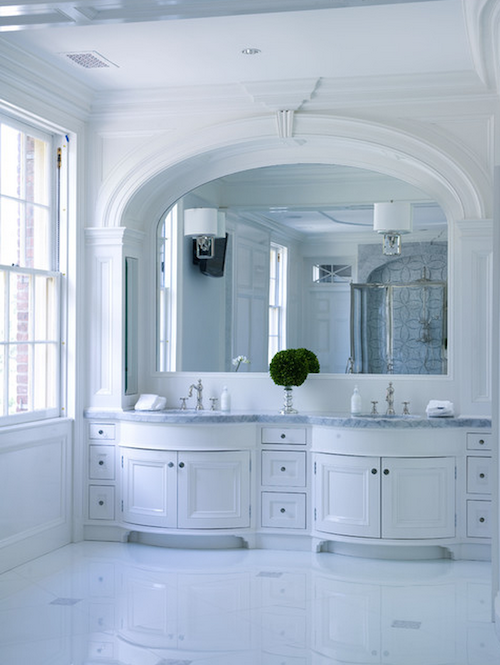 Maximize your bathroom’s lighting with the streamlined look of mirror-mounted sconces.