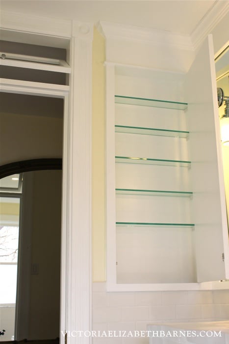 We designed and built an extra-tall, mirrored storage and medicine cabinet for our old-house bathroom remodel… it’s a GREAT way to use the space between wall studs!!