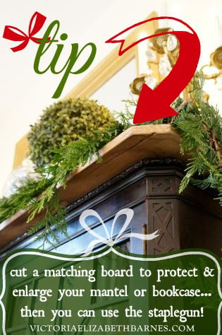 Christmas decorating tip – cut a board to protect your mantel -then you can use the staple gun! It's also a great way to make the mantel deeper