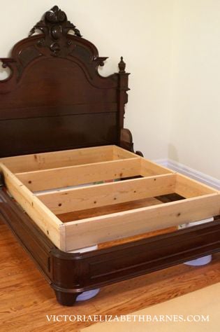 We got this fantastic, antique bed on craigslist, but it’s only a full-size… see how we retrofitted it to accommodate our queen-size mattress. 