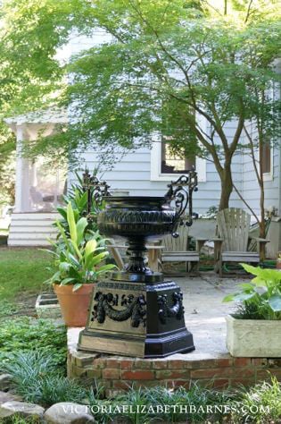 I got this huge, antique urn on Craigslist… We had it sandblasted and learned how to make a latex mold to replace the missing fancy pieces.