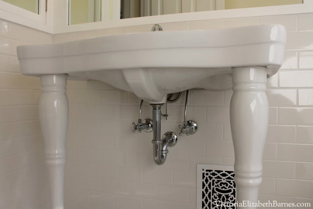 Our DIY vintage bathroom remodel, we used reproduction bath fixtures, a console sink, and subway tile.