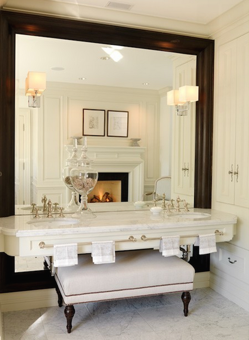 Maximize your bathroom’s lighting with the streamlined look of mirror-mounted sconces.