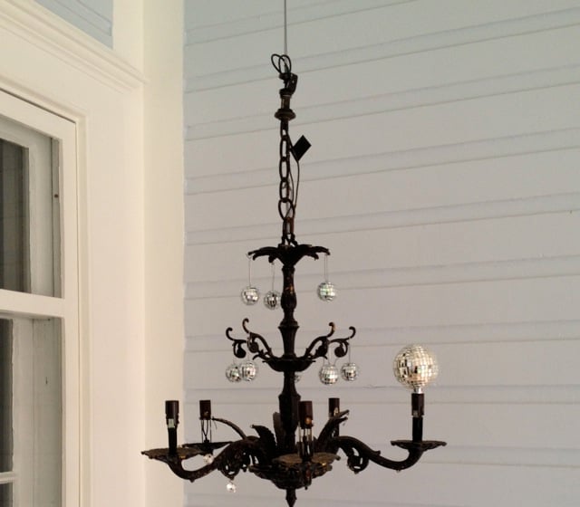 make your own chandelier with disco balls and rice fairy led lights. Victorian porch decoration