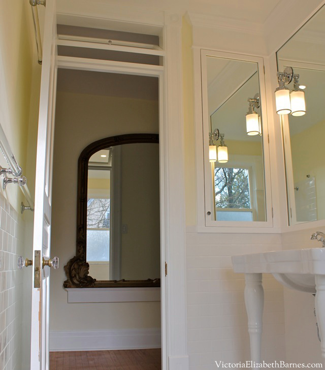 Old house bathroom remodel with vintage design. Subway tile, marble lookalike, custom cabinet, transom window..