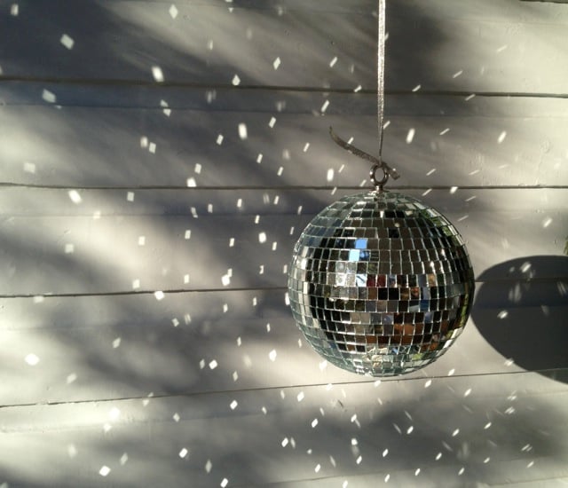 Disco balls from The Christmas Tree Shop. Non religious holiday decorations. Fun porch décor that is pretty during the daytime.
