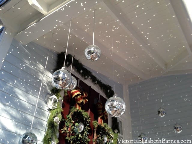 I used DISCO balls for the greatest front porch Christmas decorations EVER.