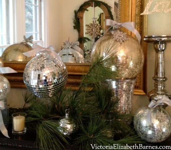 Fast, easy Christmas decorations using household items. Dining room holiday decorations. Adding bows to holiday ornaments.