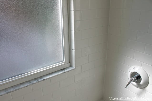 Old-house DIY bathroom remodel, solution for window in shower.