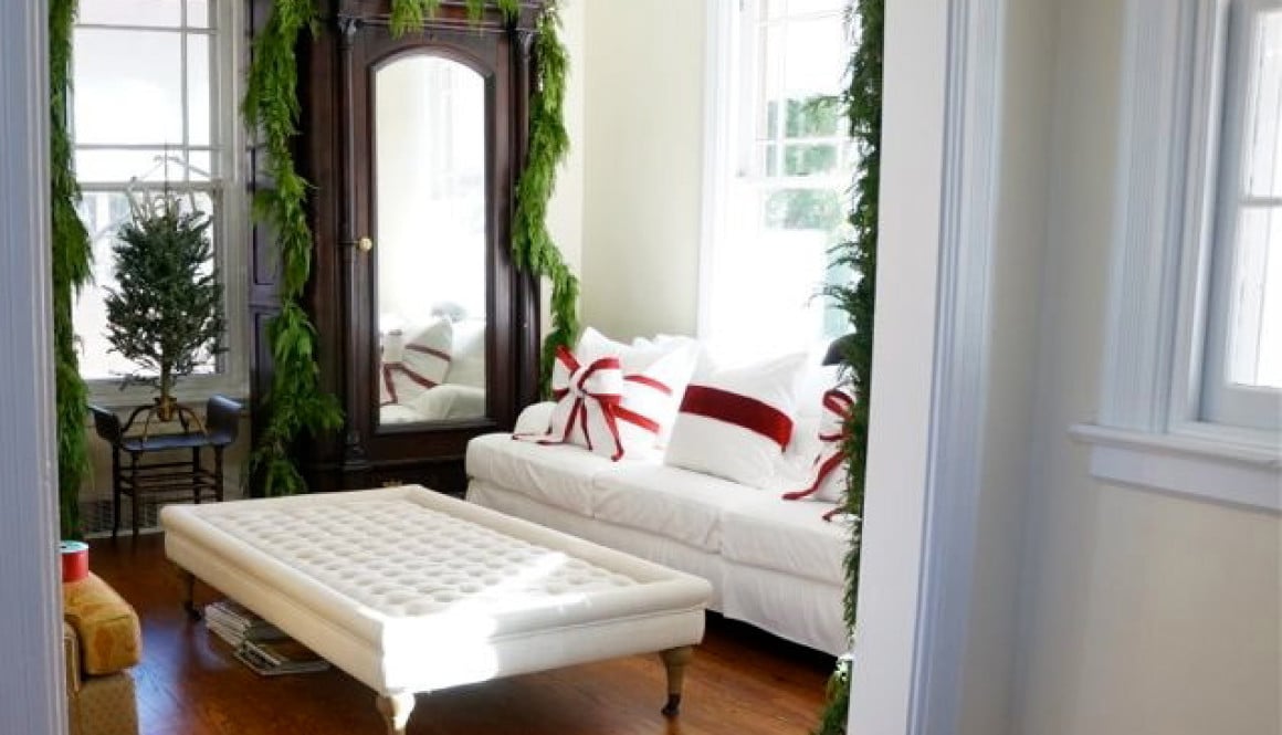 A simple bow turns your sofa pillows into Christmas decorations!! I LOVE the two-tone bow!