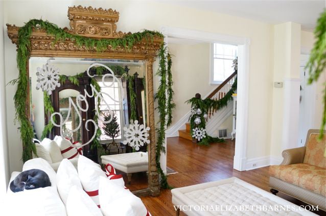 Decorating our Victorian home for Christmas… I used glitter to write on the giant antique mirror I scored on Craigslist!!