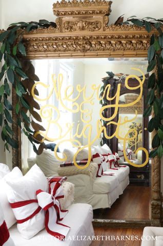 Write a holiday message that looks like gold leaf… glitter optional… I decorated the giant mirror (I scored on Craigslist!) but you can write on any glass surface.